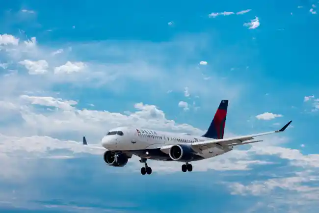 A Delta Airlines aircraft flying in mid-air.