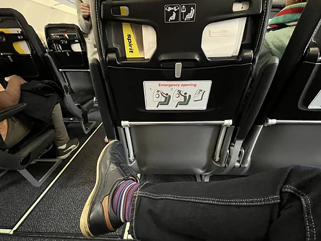 Picture of author sitting in an exit row seat on Spirit Airlines
