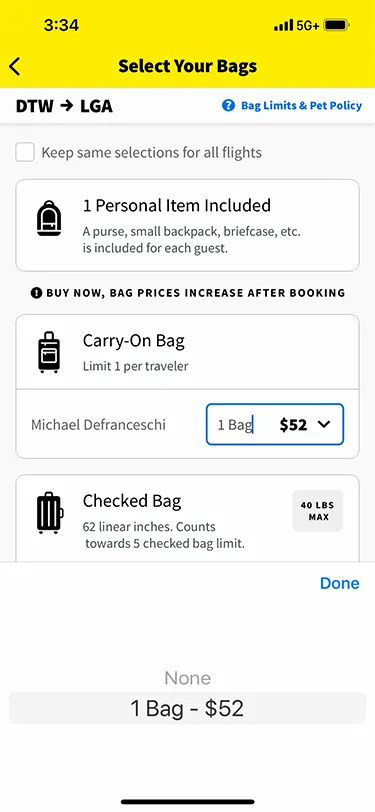 Screenshot from the Spirit Airlines app showing baggage fees for carry on bags on a flight from DTW to LGA