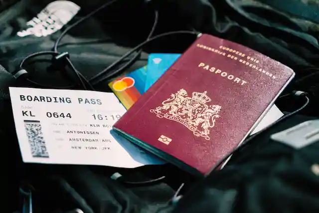 Paper copies of a passport and boarding pass.