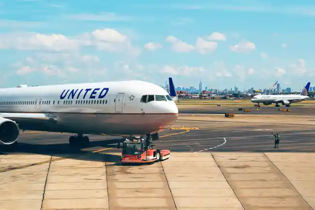A United Airlines aircraft parked on a landing strip.
