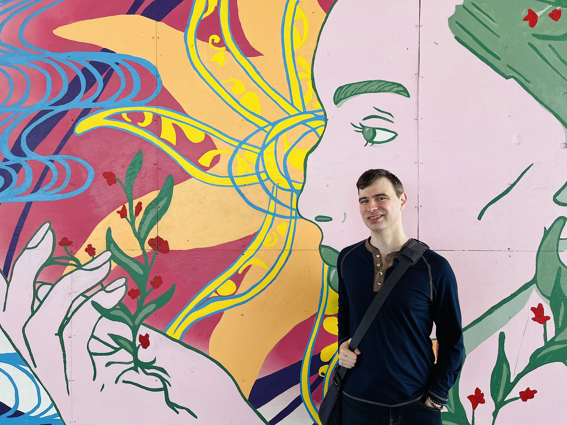 Cover image of travel blogger Michael DeFranceschi in front of a mural in Omaha, NE, USA