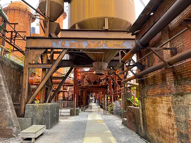 A walkway in Sloss Furnaces National Historic Landmark. Visiting this industrial museum helps answer the question 'Is Birmingham AL worth visiting'.