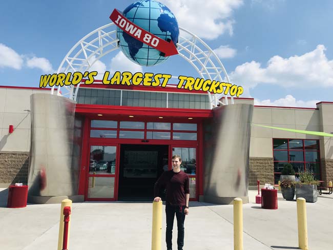 Author Michael DeFranceschi standing in front of the entrance of the I-80 Truckstop in Iowa City, IA.