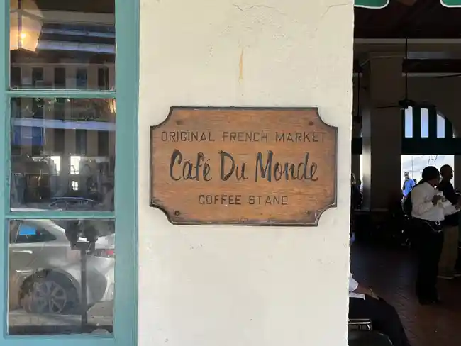 The outside wall of Cafe Du Monde. Cafe Du Monde is one of the 11 best things to do for a weekend in New Orleans.