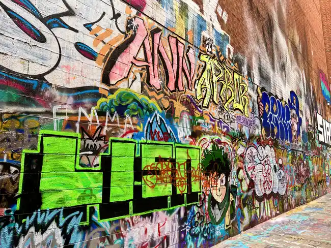 The name of the city 'Ann Arbor' spray painted in Graffiti Alley. Graffiti Alley is one of the most fun things to do in Ann Arbor.
