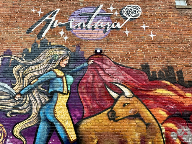A mural in downtown Ann Arbor outside the restaurant Aventura by artist Martin Kazan located at 216 E Washington St.