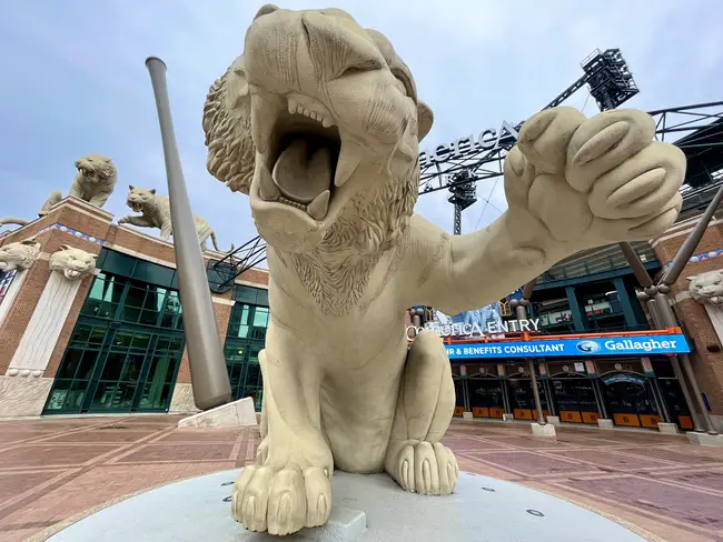 A large tiger statue outside the main entrance to Comerica Park.
