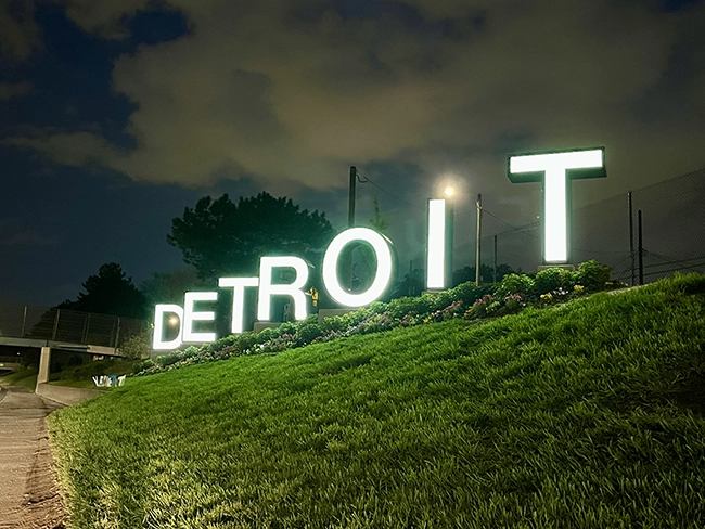 US Travel Blogs, US Travel Blogger, visit all 50 states. Headline image for a recent article entitled 'The New Detroit Sign on I-94: Everything You Want to Know!