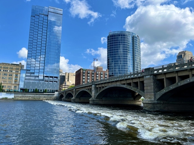 Along the riverwalk neighboring the Grand River. Going on the riverwalk is one of the best & fun things to do in Grand Rapids, MI!