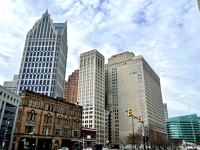 Picture of the Ally Detroit Center and Guardian Building in the same photograph in the Financial District of downtown Detroit.