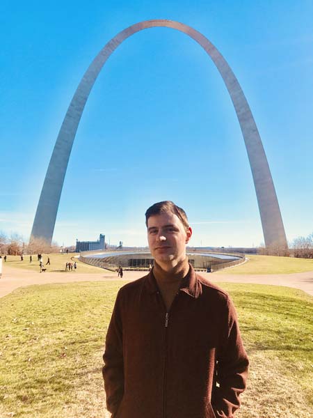 Author standing in front of the Gateway Arch-- one of the most famous landmarks in the US-- located in St Louis, Missouri. The Gateway Arch is one of the 7 midwest landmarks you must see before you die.