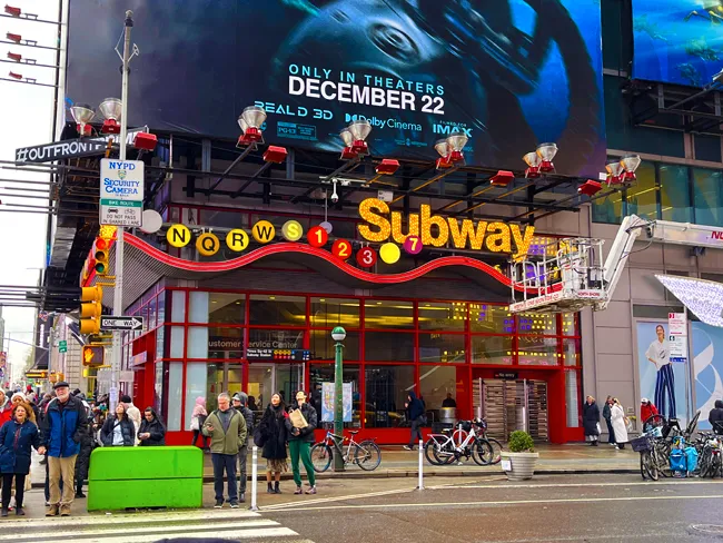 A large subway entrance for the MTA Subway system near Times Square in Manhattan, New York City.