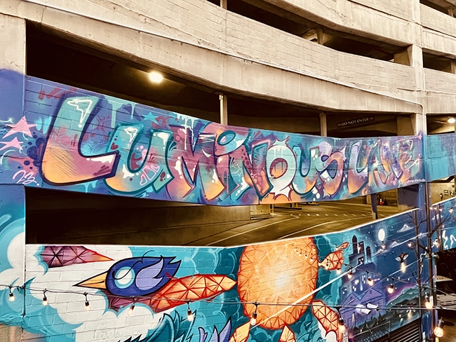 Luminous Lane is a new hotspot in uptown Charlotte, featuring several murals and some of the best street at in Charlotte.